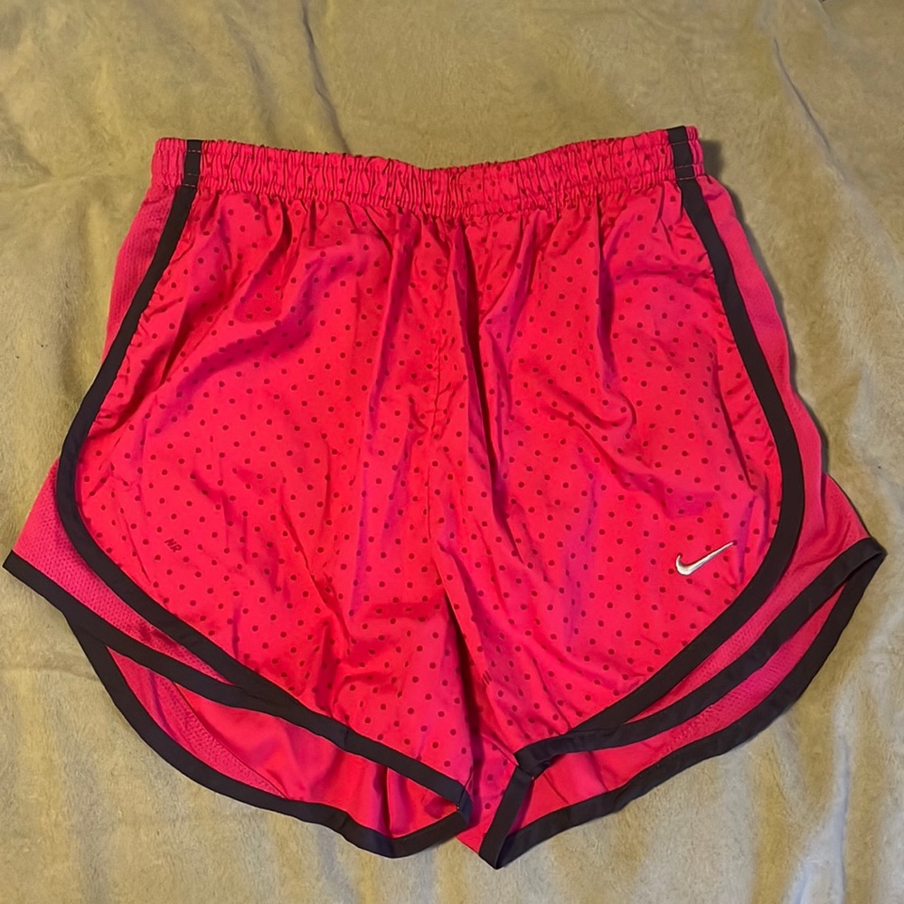 Nike pink with purple detail and polka dots.  Dri-fi and fully lined.